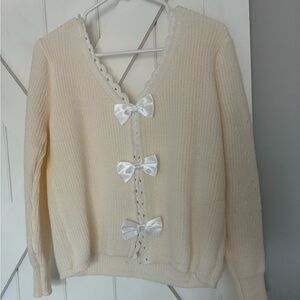 Elegant Cream Sweater with Bow Accents